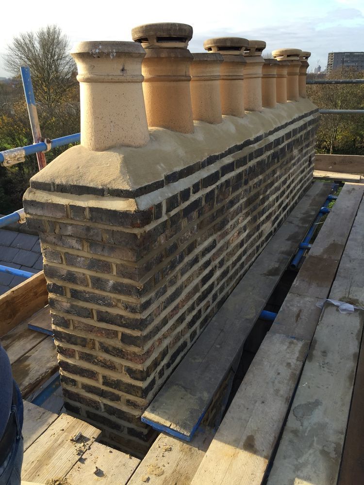 Chimney stack fully repointed in weather-struck style by City Building and Roofing Ltd